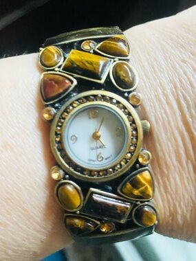 Vintage style women's quartz cuff watch featuring tigers eye stones.